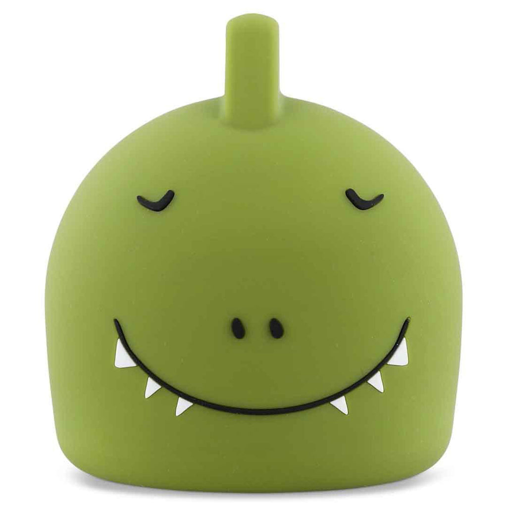 Cute green dino lamp with a round body and a small horn on top, featuring a large, smiling mouth with tiny teeth and shut eyes, exuding a playful vibe.