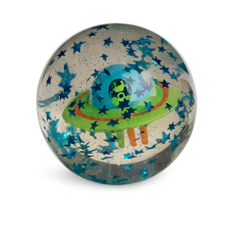 A clear globe with floating blue stars encases a colorful UFO with a green alien inside, against a black background. Playful and whimsical.