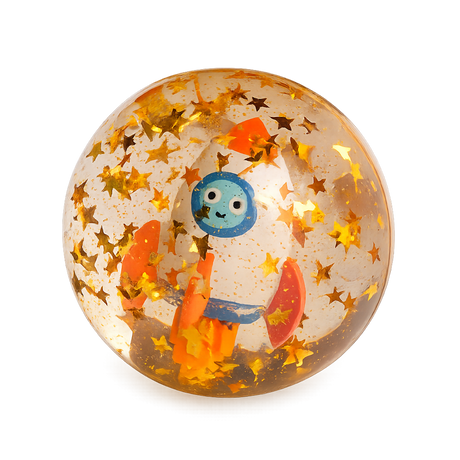 A transparent ball contains a smiling cartoon rocket surrounded by golden star confetti. The playful scene exudes a whimsical, space-themed charm.