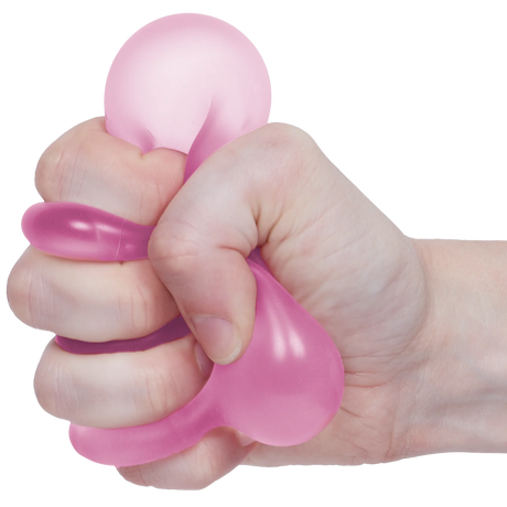 Pink Speks Loop Gump memory gel stress ring being squeezed in a hand.