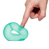 Speks Loop Gump seaglass memory gel stress ring squished by a finger on a black background.