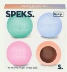 Four Speks memory gel stress balls in green, blue, pink, and brown are shown in a box. The mood is calm and soothing.