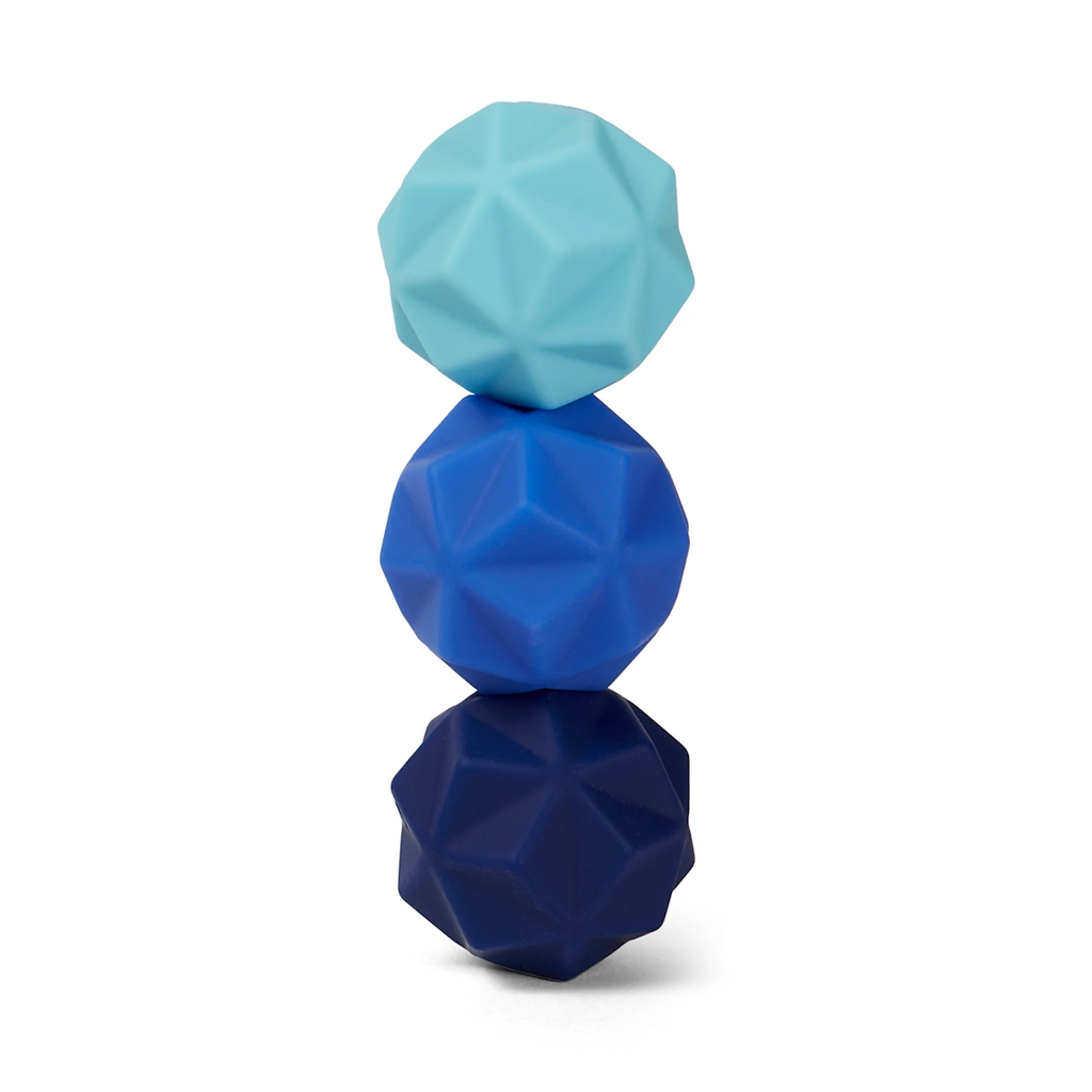 Three geometric massage balls stacked vertically. The top is light blue, the middle is medium blue, and the bottom is dark blue, against a white background.