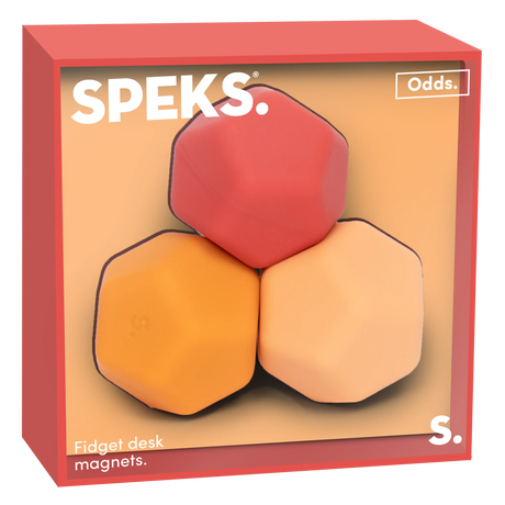 Three polygonal fidget desk magnets in a box. The magnets are red, orange, and peach, set against a soft background. The box has a modern, playful design.