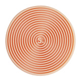 Circular orange silicone sensory sticker with concentric ridges and an "S." logo in the center.