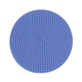 Circular light blue silicone sensory sticker featuring a raised dot texture with an "S." logo centered in the middle.