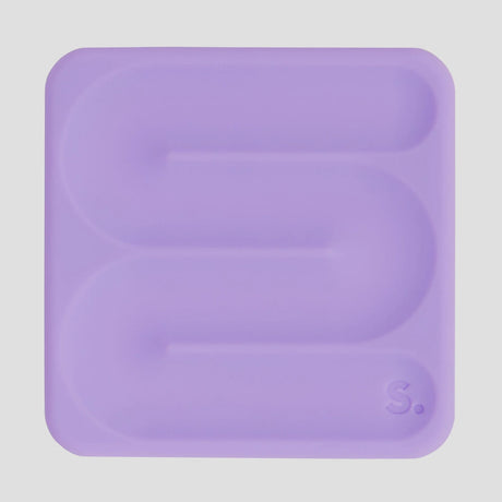 Square lavender silicone sensory sticker with a smooth S-shaped grooved path and "S." logo.