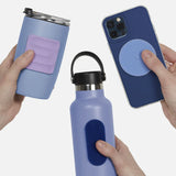 Hands holding blue items with textured silicone sensory stickers attached.