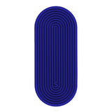 Oval blue silicone sensory sticker with concentric linear grooves and an "S." logo near the bottom.