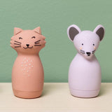 Pink cat and purple mouse silicone squeezy animal toys for kids on a wooden surface.