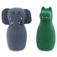 Cute gray elephant and green crocodile-shaped silicone containers side by side. The elephant has floppy ears and a curled trunk; the crocodile has small eyes.