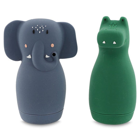 Cute gray elephant and green crocodile-shaped silicone containers side by side. The elephant has floppy ears and a curled trunk; the crocodile has small eyes.