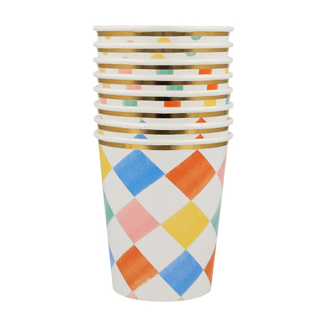 Stack of Meri Meri colorful diamond pattern paper cups with gold foil rims, perfect for birthday party tableware.