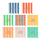 Assortment of colorful striped birthday napkins with gold foil text and scalloped edges.