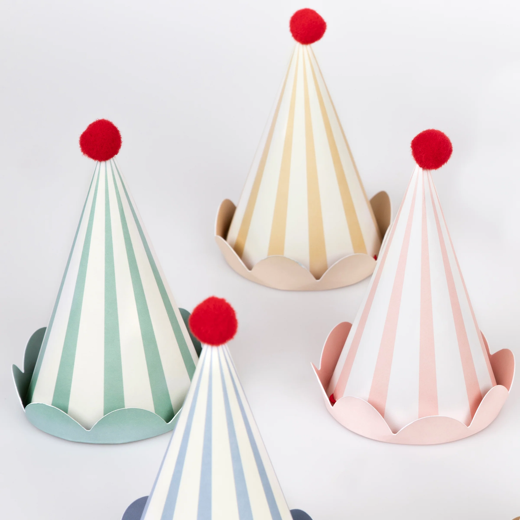 A set of cone-shaped hats with soft pastel stripes and pom-pom tops, ideal for birthdays and spring celebrations.