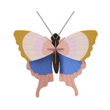 Illustration of a butterfly with wide, symmetrical wings in pastel colors of pink, blue, and yellow. The design is simple and elegant, conveying calmness.