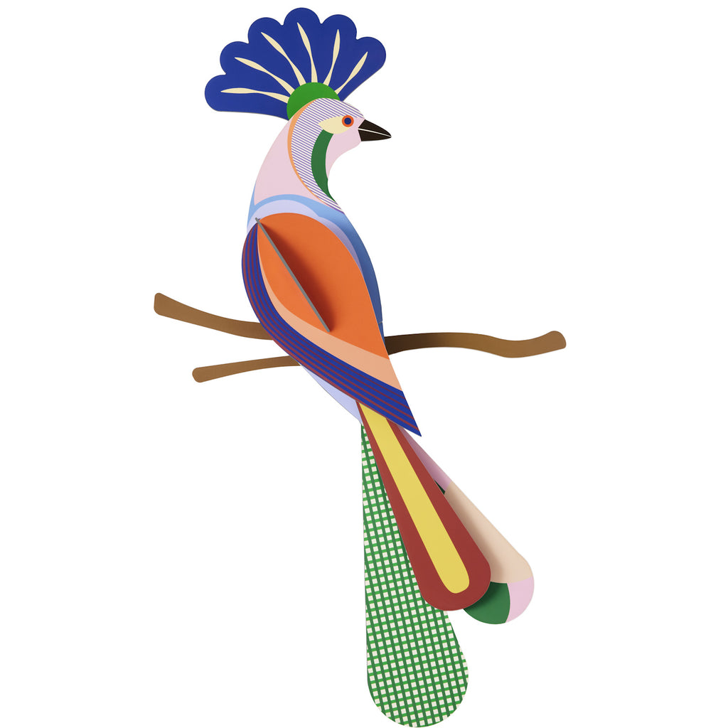 A colorful, abstract illustration of a bird with a blue, fan-shaped crest perched on a branch. The bird features geometric shapes and vibrant patterns.