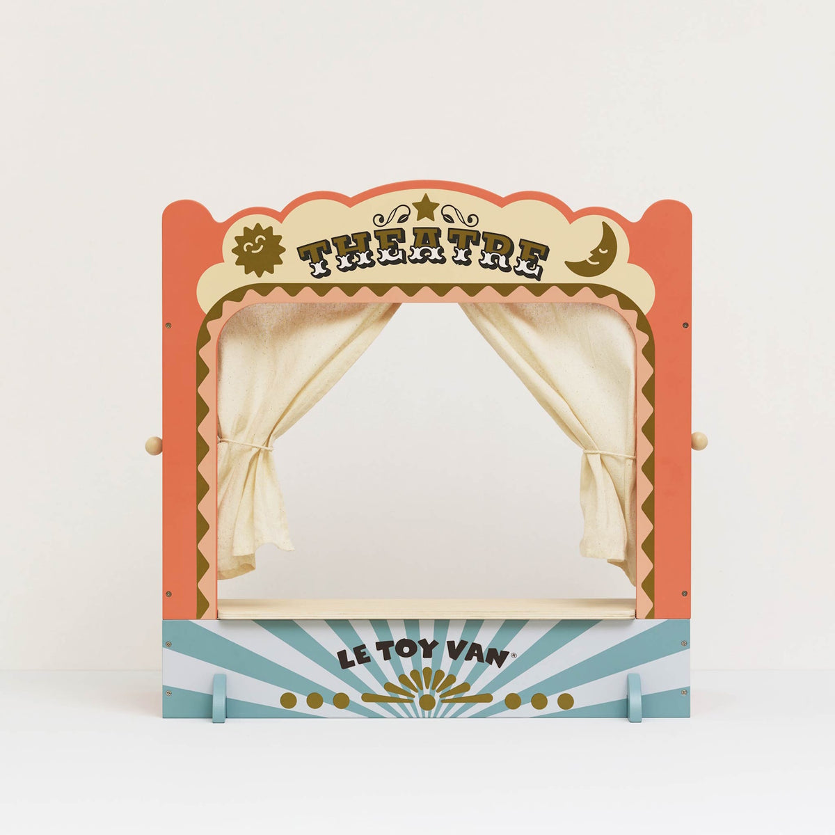 Vintage-style wooden tabletop puppet theatre with tied-back fabric curtains.