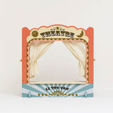 Vintage-style wooden tabletop puppet theatre with tied-back fabric curtains.