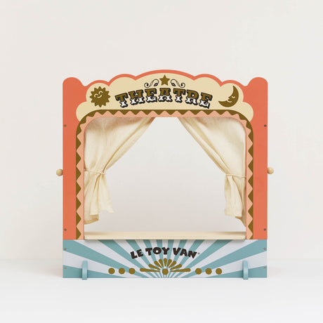 Vintage-style wooden tabletop puppet theatre with tied-back fabric curtains.