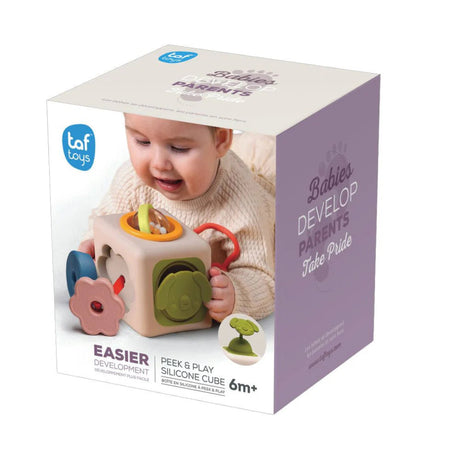 Taf Toys Peek & Play Silicone Cube packaging featuring a baby playing with the sensory toy cube.