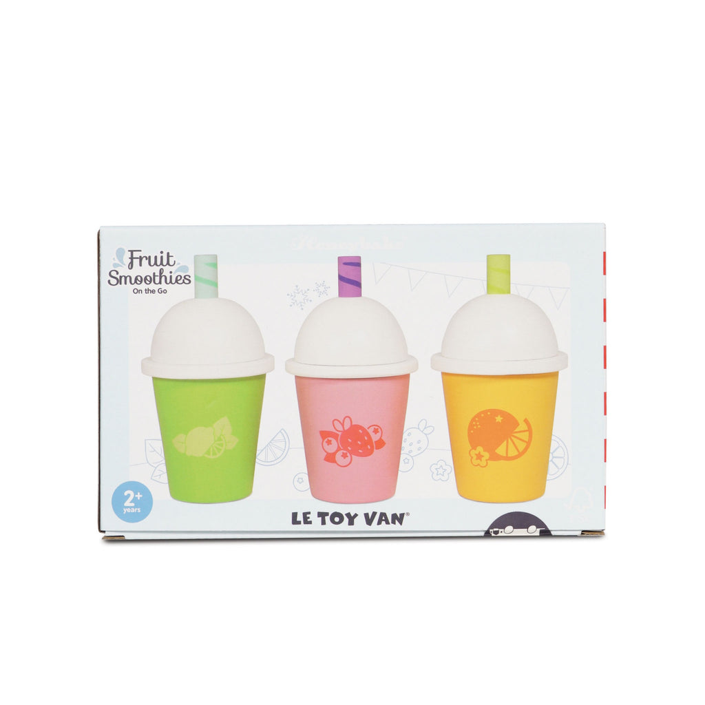 Fruit Smoothies on the Go set packaging featuring three colorful cups with fruit designs: green with limes, pink with strawberries, and yellow with oranges. Playful and vibrant.