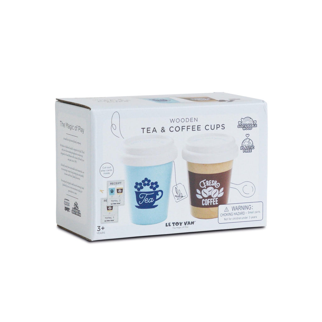 Box packaging of wooden tea and coffee cups with white lids. One cup is blue with floral tea design, the other brown with coffee beans. Toy-themed.
