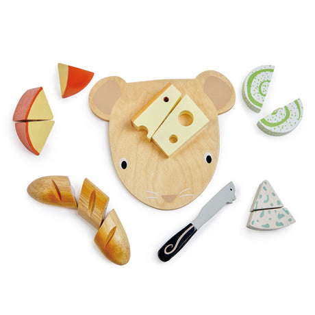 Wooden mouse-shaped chopping board with a toy knife and wooden play food pieces on a white background.