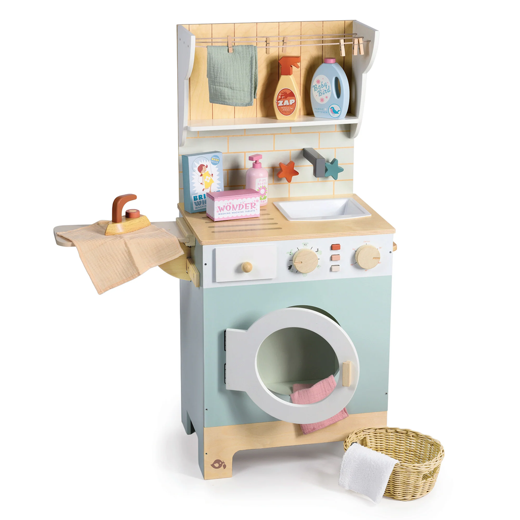 Wooden play set featuring a miniature washing machine, ironing board, and laundry accessories for imaginative role play and tidy-up fun.