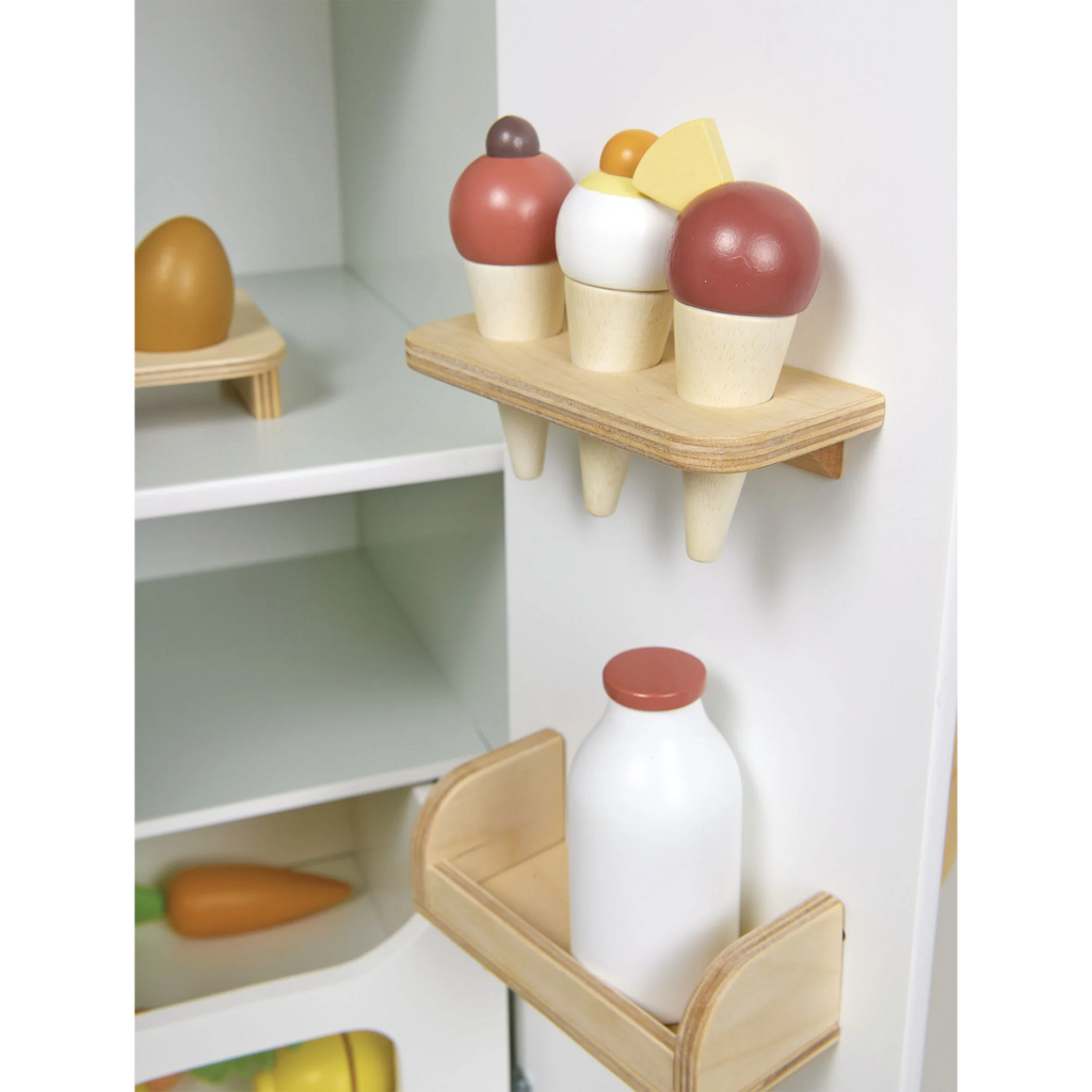A wooden play set with a retro-style fridge design, opening doors, and shelves stocked with toy food items—perfect for imaginative kitchen play.