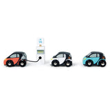 Orange, white, and blue toy cars, with the orange car plugged into a charging station.