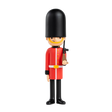 Toy soldier figure styled as a British royal guard in a red uniform and tall black hat, holding a rifle. Stands against a plain white background.