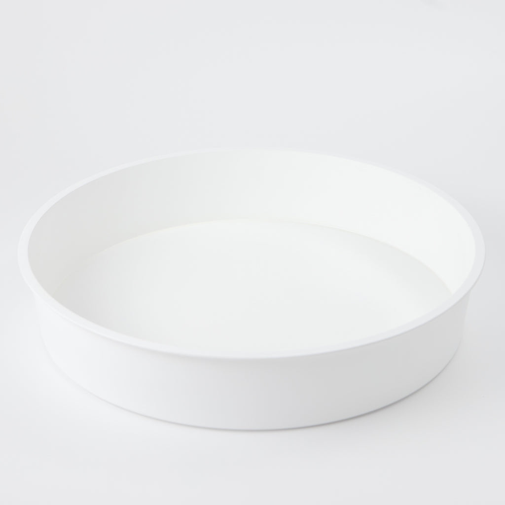 A white sensory play tray.