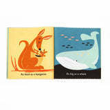Open cloth book showing illustrations of a kangaroo with its joey and a large whale swimming.