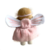 Back view of a small plush fairy doll showing white wings, a pink dress with a backpack pocket, and headband.