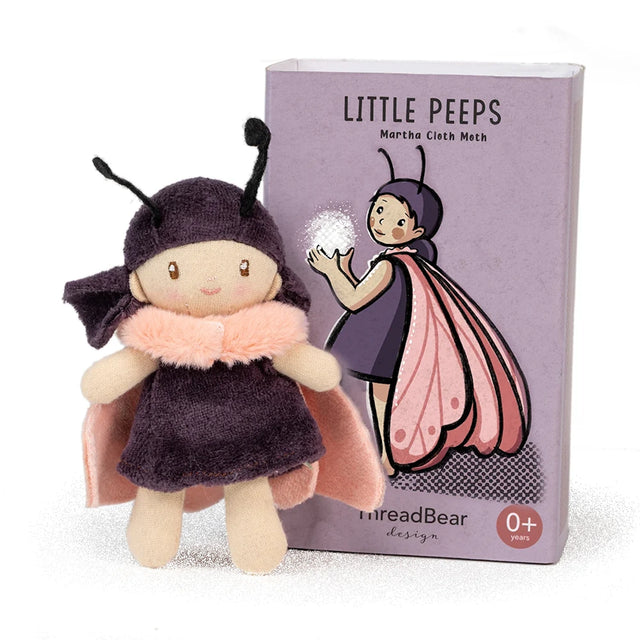 Small "Little Peeps Martha Cloth Moth" plush doll standing in front of its purple illustrated box.