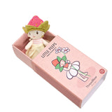 "Poppy Strawberry" doll sitting inside its open pink matchbox-style packaging.