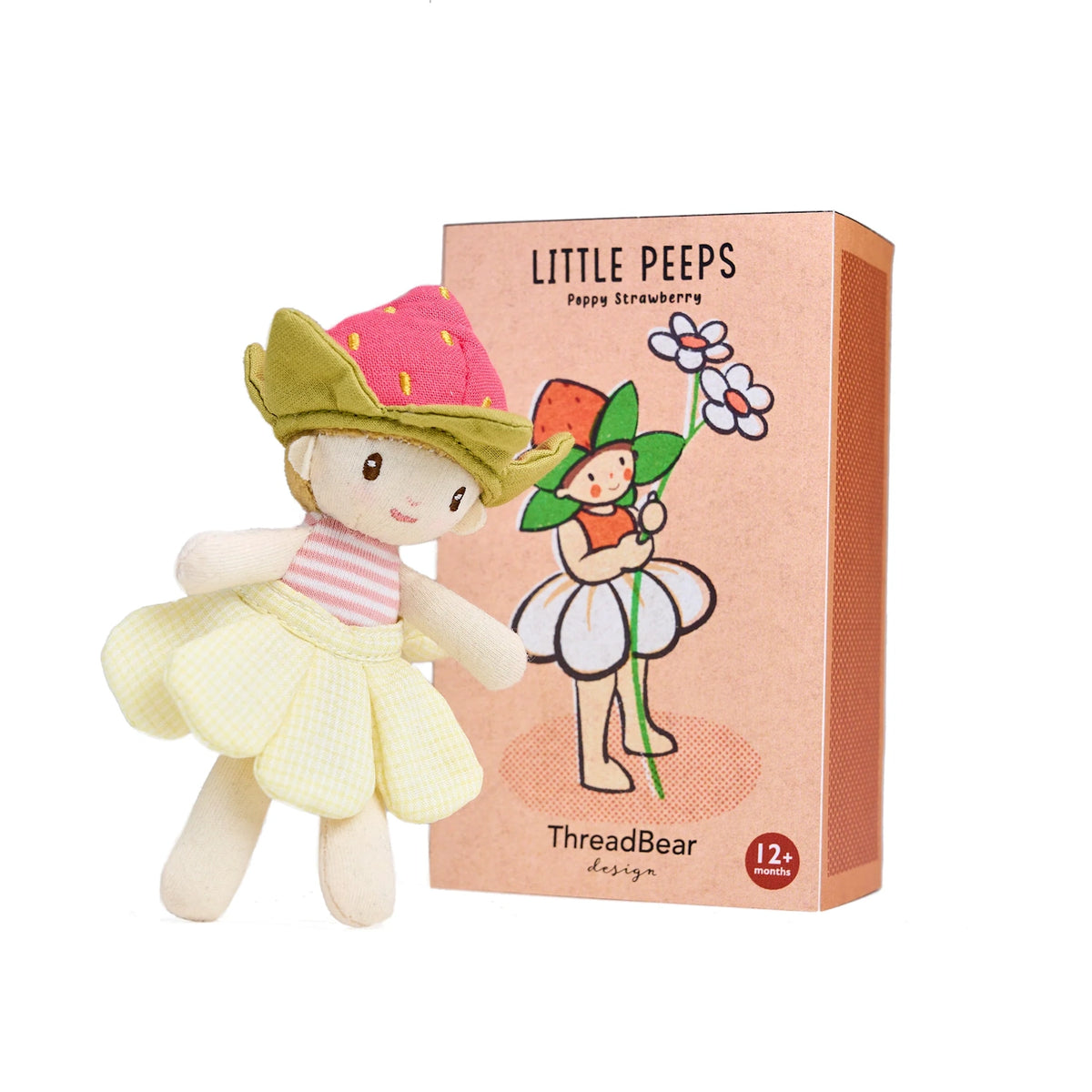 Small "Little Peeps Poppy Strawberry" plush doll wearing a strawberry hat and yellow skirt, standing next to its peach-colored illustrated box.
