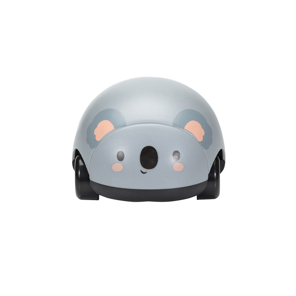 Gray toy shape with a smiling koala face, featuring black eyes, a dark nose, and pink cheeks. It has subtle ear details and small wheels.