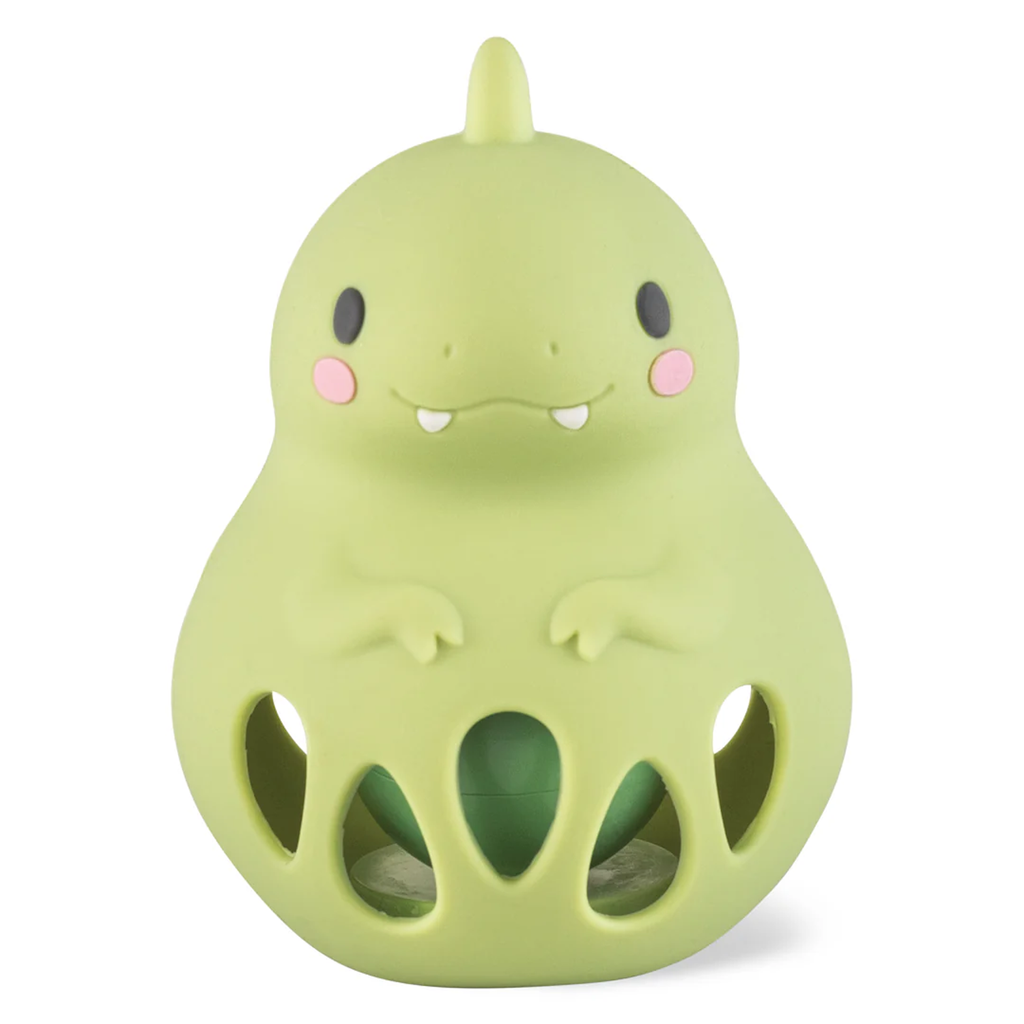 Cute green dinosaur toy with rounded shape, small arms, rosy cheeks, and visible teeth. Hollow section at the bottom creates a playful look.