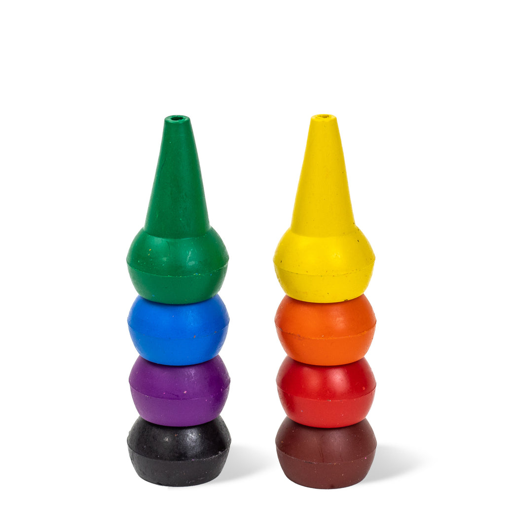 Two stacks of colorful, cone-shaped crayons are standing side by side. The left stack includes green, blue, purple, and black. The right stack features yellow, orange, red, and brown.