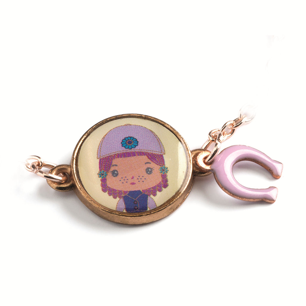 A children's bracelet from Djeco's Tinyly collection featuring a gold-colored chain and a charm of Joe, a character depicted with a horse and a heart-shaped accessory.