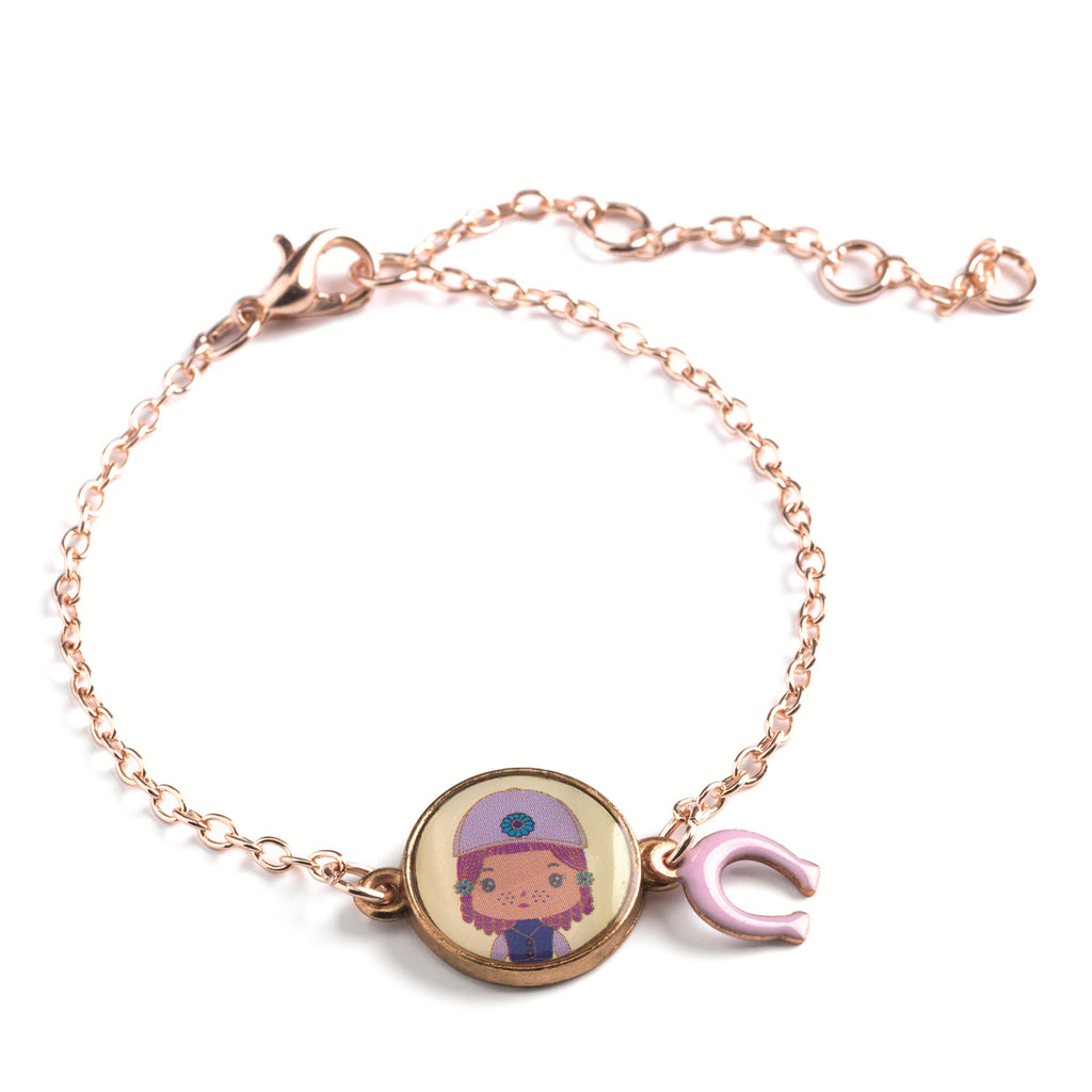 A children's bracelet from Djeco's Tinyly collection featuring a gold-colored chain and a charm of Joe, a character depicted with a horse and a heart-shaped accessory.