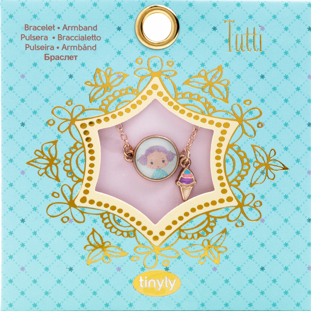 A children's bracelet from Djeco's Tinyly collection featuring a gold-colored chain and a pendant of Tutti, a character depicted with an ice cream accessory.