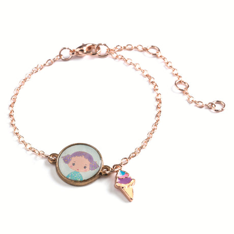 A children's bracelet from Djeco's Tinyly collection featuring a gold-colored chain and a pendant of Tutti, a character depicted with an ice cream accessory.