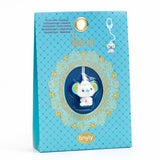 A cute, stylized koala charm with colorful ears, a smiling face, and a small red drop on its chest, hanging from a white string.