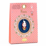 A keyring from Djeco's Tinyly collection featuring a finely sculpted figurine of Minico, a ladybug character.