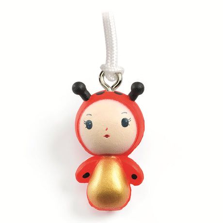 A keyring from Djeco's Tinyly collection featuring a finely sculpted figurine of Minico, a ladybug character.