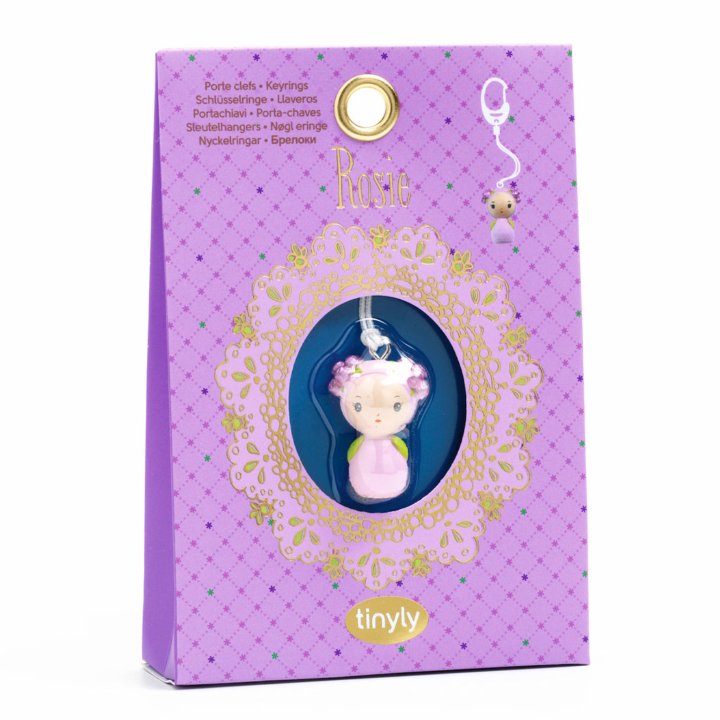 A white metal key ring featuring a finely sculpted pendant of Rosie, a character from Djeco's Tinyly collection.