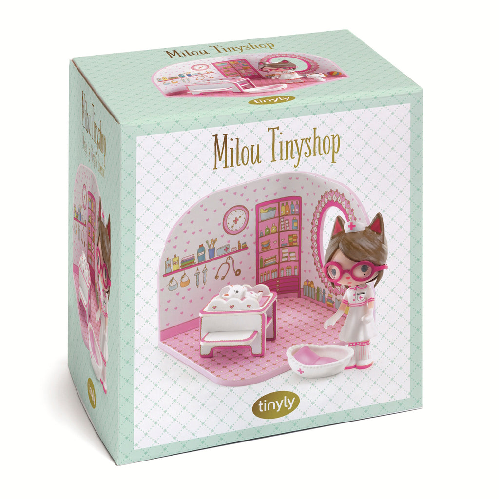 A playful scene featuring a nurse doll with cat ears, a white kitten, and a colorful, heart-themed room with shelves and toys.